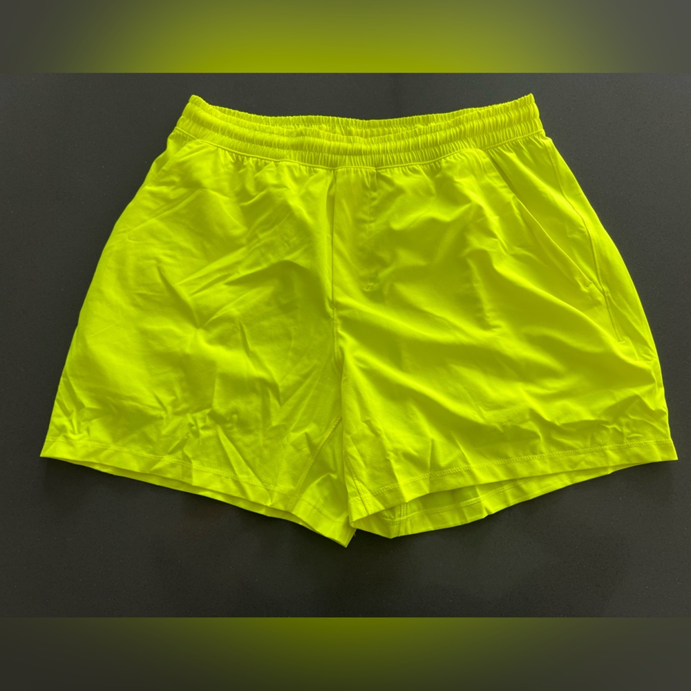 Neon yellow Lululemon pace breaker shorts